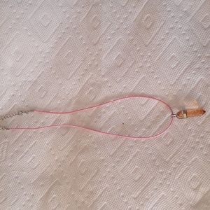 Clear pink bullet pendant